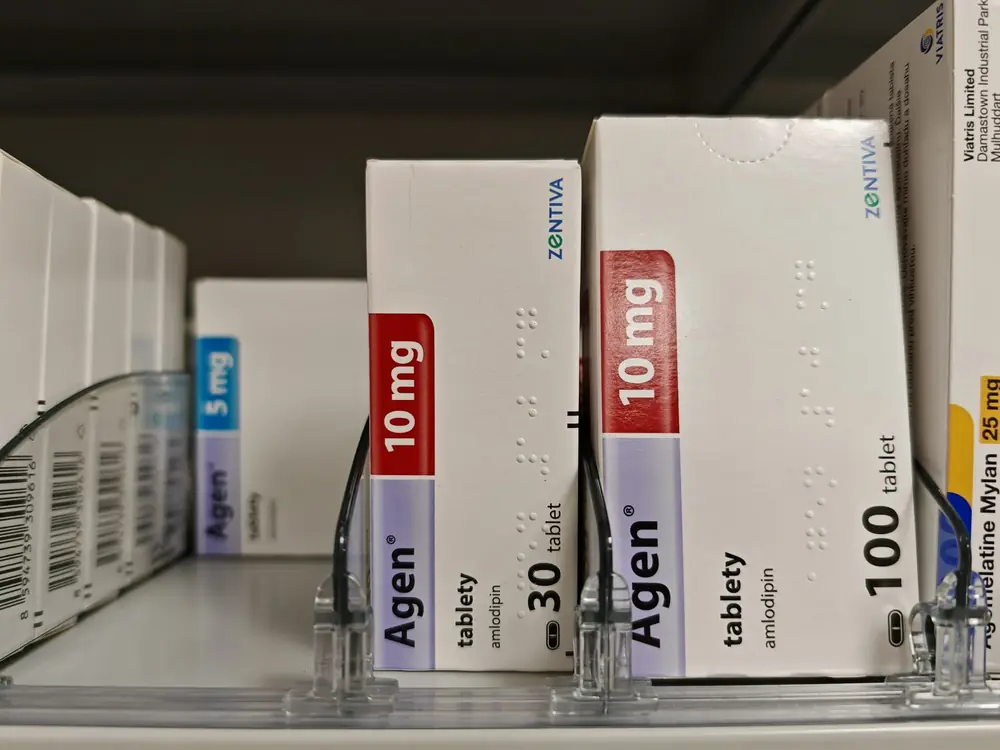 Medicine boxes line a shelf.